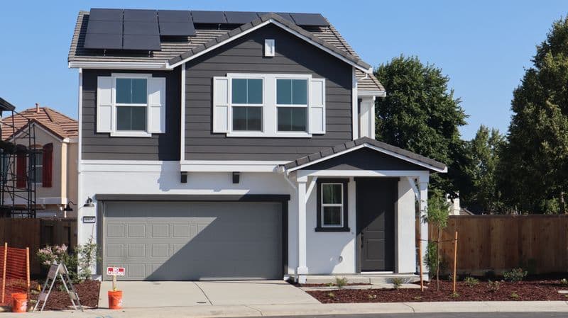 Modern home with solar panels installed on the rooftop
