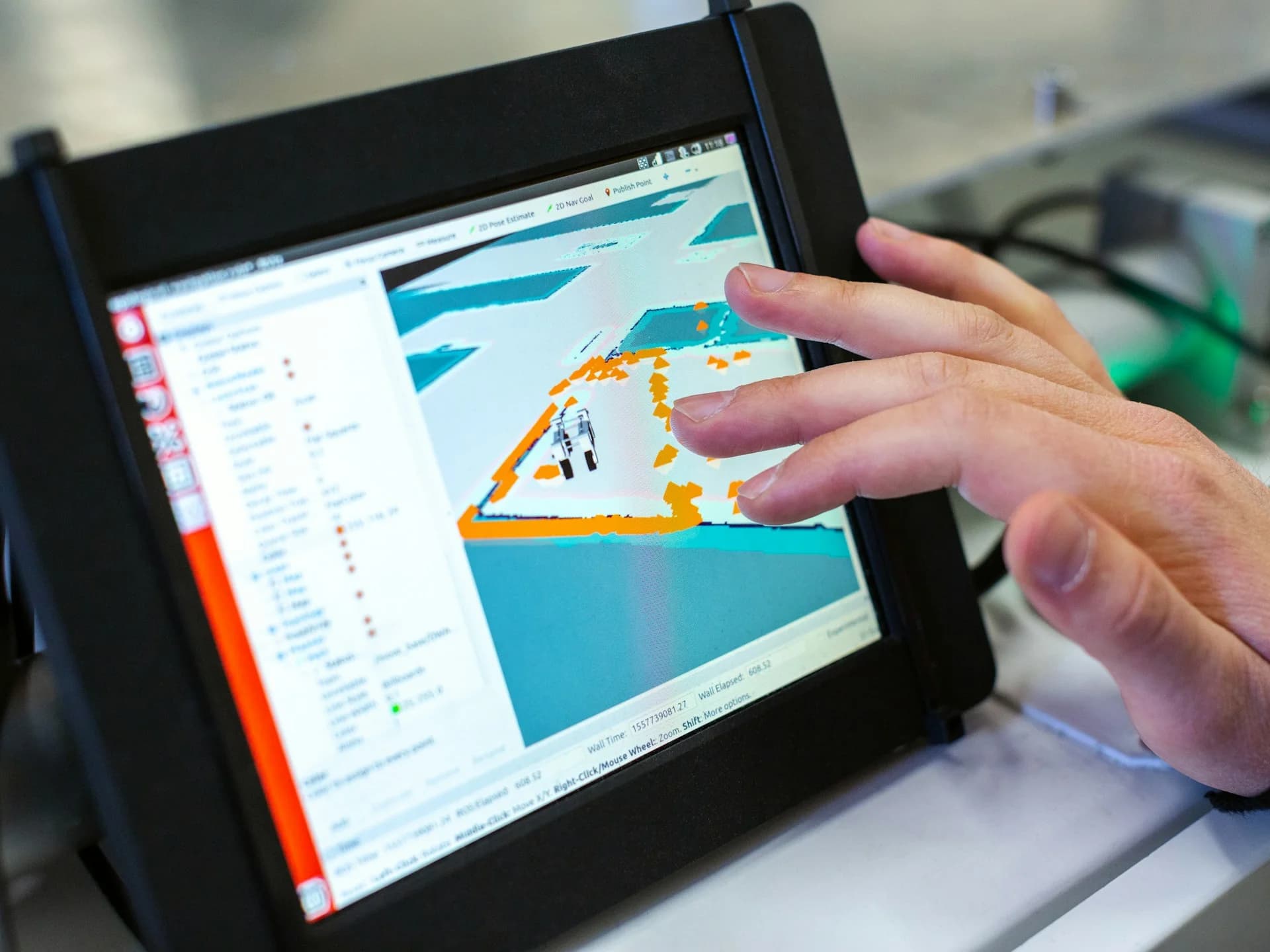 Engineer reviewing GIS mapping data on a rugged field tablet